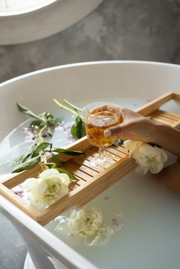 Photo by Monstera Production from Pexels: https://www.pexels.com/photo/woman-with-wineglass-and-flowers-in-bathtub-6621173/