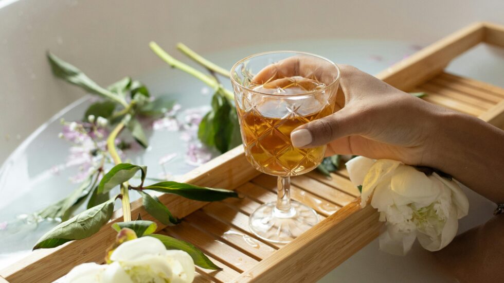 Photo by Monstera Production from Pexels: https://www.pexels.com/photo/woman-with-wineglass-and-flowers-in-bathtub-6621173/